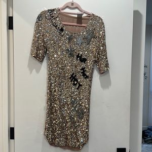 This is an original Lanvin gold sequin dress in good condition